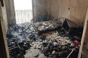 نجات پیرزن ناتوان از آتش‌سوزی ساختمان مسکونی