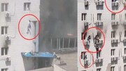 عکس | لحظه وحشتناک آویزان شدن از پنجره های بیمارستان برای نجات از آتش | ۲۱ نفر جان خود را از دست دادند
