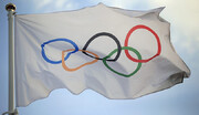 تصاویر نامداران ورزش ایران زیر بزرگترین پرچم المپیک