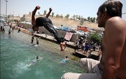 تصاویر هیجان انگیز از شنای خوزستانی‌ها در تفریحگاه ساحلی «دز»