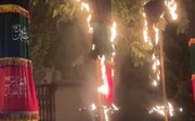 تصاویر و جزئیات حمله چند ناشناس به علم عزای سیدالشهدا(ع) در اصفهان | واکنش مردم به لحظه آتش زدن علم و کتل سیدالشهدا(ع)