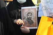 تصاویر شهدا در دست برخی از جاماندگان اربعین در تهران
