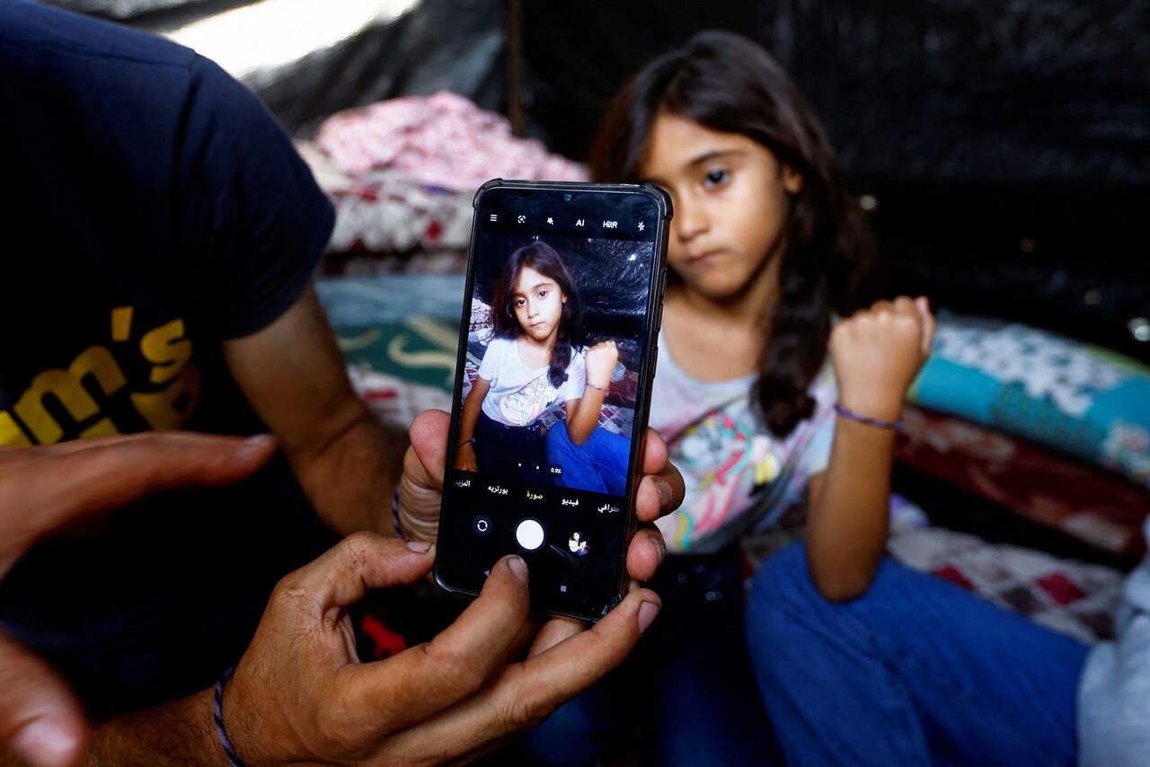 تصاویر | راهکار مردم غزه برای پیدا شدن پس از شهادت و دفن نشدن در گورهای دسته‌جمعی