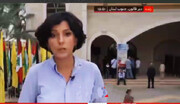 ببینید | لحظه عبور کودک با پرچم حزب الله در پخش زنده تلویزیونی | واکنش خبرنگار بی بی سی را ببینید