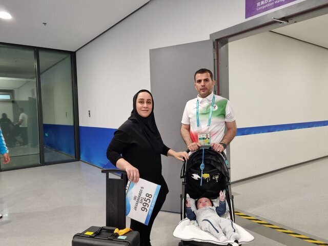 عکس | حضور ورزشکار زن ایرانی با فرزند خردسالش در جام جهانی کره