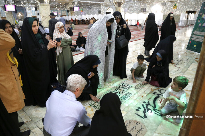 حضور مردم در کنار مزار شهید امیرروزانه مردم  عبداللهیان