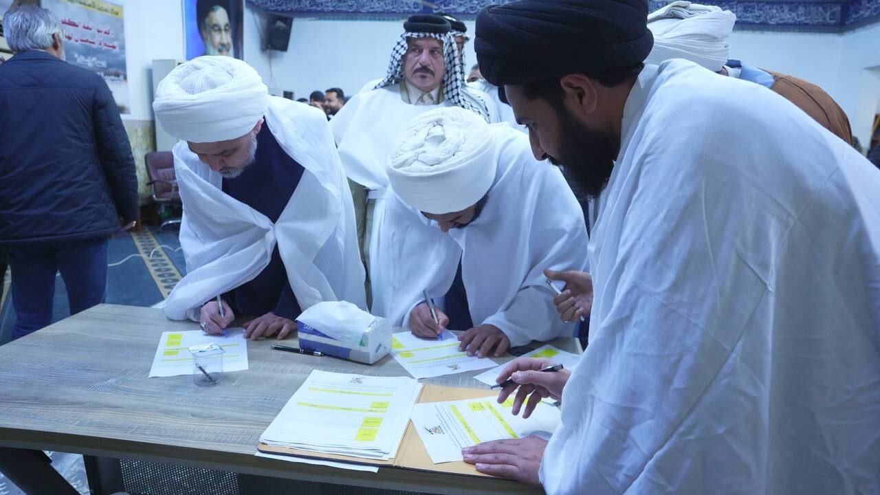 رزمندگان حزب الله عراق برای حمایت از ایران کفن پوش شدند+ تصاویر | نام نویسی آنها برای مبارزه را ببینید