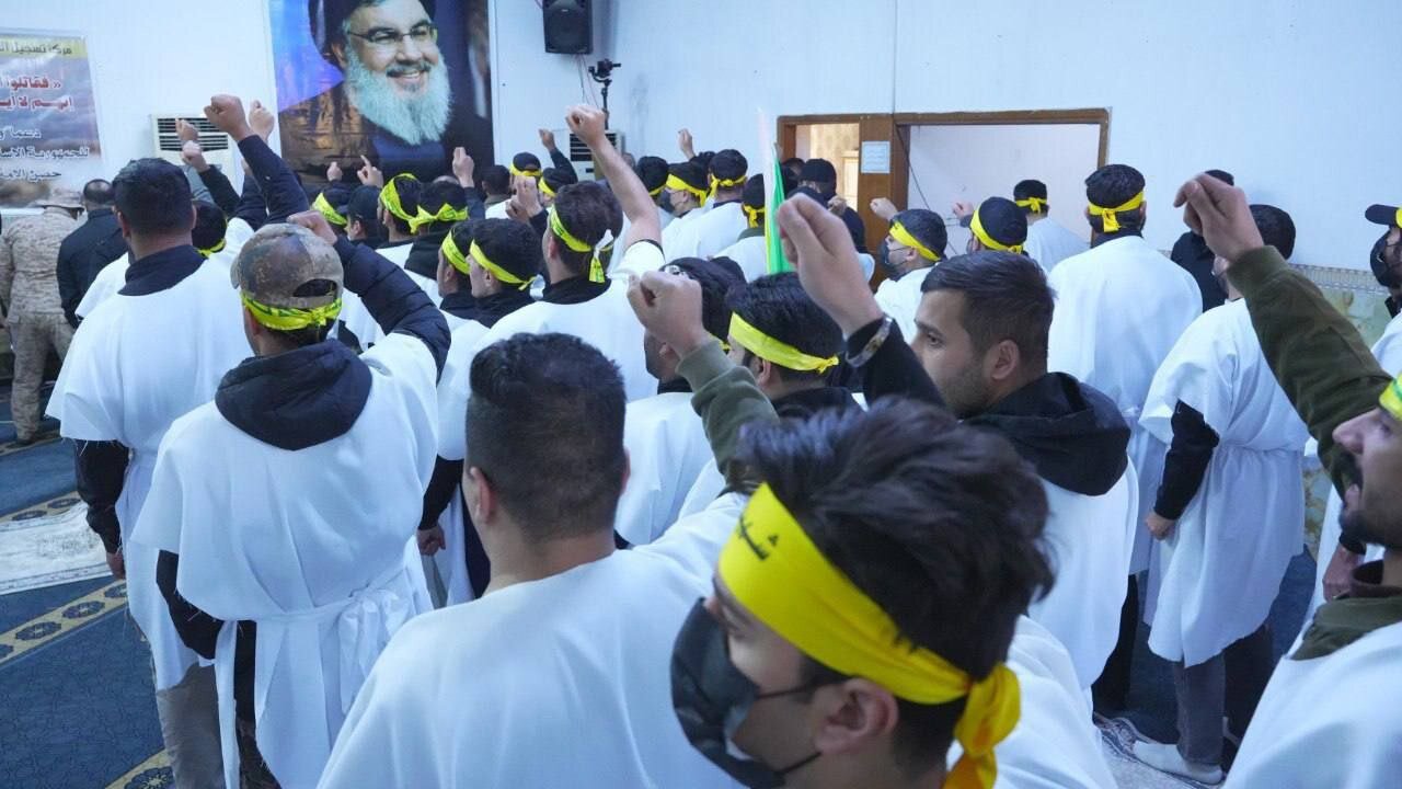 رزمندگان حزب الله عراق برای حمایت از ایران کفن پوش شدند+ تصاویر | نام نویسی آنها برای مبارزه را ببینید
