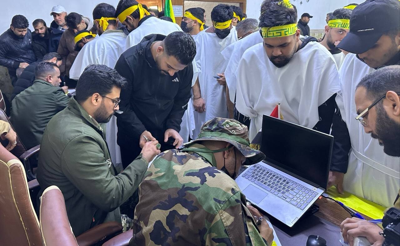 رزمندگان حزب الله عراق برای حمایت از ایران کفن پوش شدند+ تصاویر | نام نویسی آنها برای مبارزه را ببینید