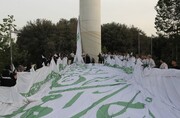 اهتزاز بزرگترین پرچم علوی در تهران همزمان با ۱۱۰ نقطه در جهان