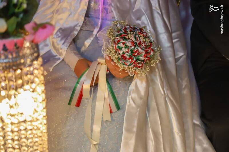 دستهگل عروس با رنگهای پرچم ایران؛ عکسی که وایرال شد!