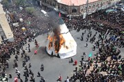 آیین خیمه سوزان عاشورا در چهارراه گلوبندک تهران