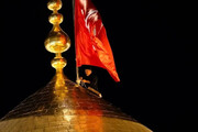 تصاویری دیدنی از تعویض پرچم حرم امام حسین (ع) و حضرت عباس(ع)